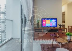 a living room with a television on a table at TimurBay Stunning By CA CON in Kuantan