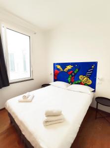 Postel nebo postele na pokoji v ubytování Tric Trac Hostel