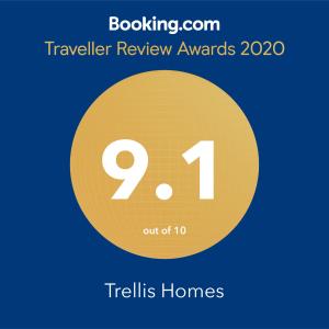 a yellow circle with the number and the text trails homes at Trellis Homes in Colombo