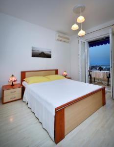 Postel nebo postele na pokoji v ubytování APARTMENT ARIA