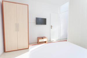 TV a/nebo společenská místnost v ubytování APARTMENT ARIA