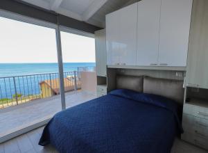 A bed or beds in a room at Barbara's house - Sardinia