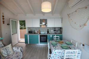 A kitchen or kitchenette at Barbara's house - Sardinia
