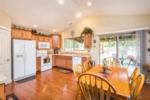 a kitchen with wooden floors and a table and chairs at Charming Wine Country Retreat! 4 Bedroom 2 Bath in Walla Walla