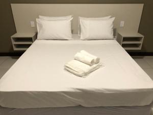Cama o camas de una habitación en Hotel Guarujá Inn Tropical