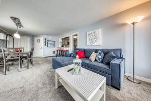 a living room with a blue couch and a table at Timberbrook #215A in Brian Head