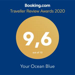 ein Zeichen, das Reisebewertungspreise mit einem gelben Kreis liest in der Unterkunft Your Ocean Blue in Costa Calma