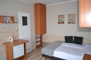 Posteľ alebo postele v izbe v ubytovaní siodemka