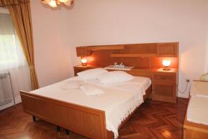 Una cama o camas en una habitación de Apartman Barbara