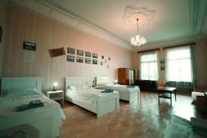 Postel nebo postele na pokoji v ubytování Guest House Old Kutaisi