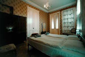 Postel nebo postele na pokoji v ubytování Guest House Old Kutaisi