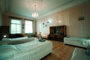 Postel nebo postele na pokoji v ubytování Guest House Old Kutaisi
