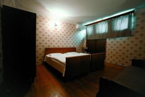 Postel nebo postele na pokoji v ubytování Guest House Old Kutaisi