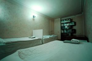 Postel nebo postele na pokoji v ubytování Guest House Old Kutaisi