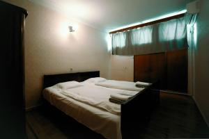 Postel nebo postele na pokoji v ubytování Guest House Old Kutaisi