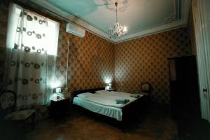 Postel nebo postele na pokoji v ubytování Guest House Old Kutaisi