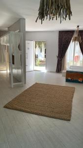 a living room with a rug on the floor at Z Exclusive Hotel and Villas in Oludeniz