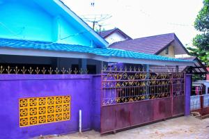 a purple fence in front of a house at KJ Purple Gate SENGGIGI in Senggigi 