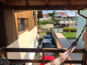 an overhead view of a porch with a hammock at Guarda Flats in Guarda do Embaú