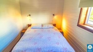 Postel nebo postele na pokoji v ubytování Hostal Compass del Sur