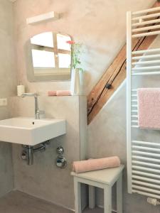 a bathroom with a sink and a staircase at Appartment Kornboden Nordic Style in Schopfheim