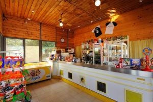 a restaurant with a counter in a store at Agriturismo Belsito Pian Di Boccio in Bevagna