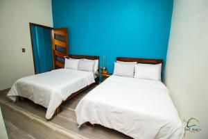 Postel nebo postele na pokoji v ubytování isel magic hotel