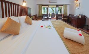 Postel nebo postele na pokoji v ubytování Greenwoods Resort, Thekkady