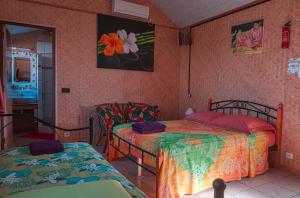 Katil atau katil-katil dalam bilik di Inaiti Lodge