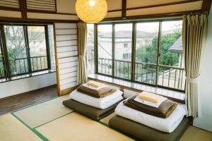 Postel nebo postele na pokoji v ubytování Onsen Guesthouse HAKONE TENT