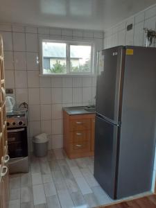 Kuchyň nebo kuchyňský kout v ubytování Cabaña Emilia Quinchen