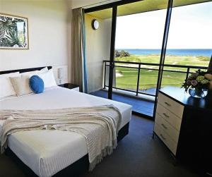 a hotel room with a bed and a window at Best Western City Sands in Wollongong