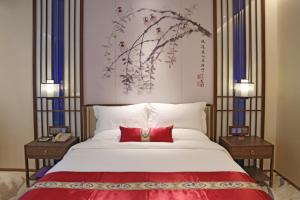 Gulta vai gultas numurā naktsmītnē Guangdong Yingbin Hotel-Free Canton Fair Shuttle Bus