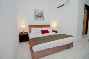 Ліжко або ліжка в номері BoraBora Beach Guesthouse Penang