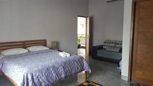 Voodi või voodid majutusasutuse Aloha Hotel Yogyakarta toas