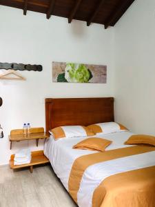 Postel nebo postele na pokoji v ubytování 40 Amigos Hotel