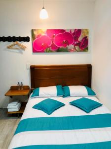 Postel nebo postele na pokoji v ubytování 40 Amigos Hotel