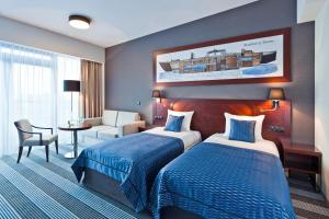 Posteľ alebo postele v izbe v ubytovaní Hotel Mikołajki Leisure & SPA - Destigo Hotels + 37 fotografií