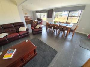 a living room with a couch and a table at Pleasant Hill BnB in Mount Gambier