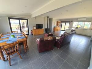 a large living room with a table and chairs at Pleasant Hill BnB in Mount Gambier