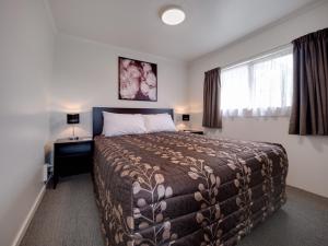Ένα ή περισσότερα κρεβάτια σε δωμάτιο στο Anderson Park Motel