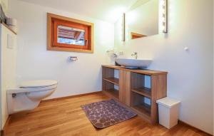 a bathroom with a sink and a toilet at Moderne Ferienwohnung-Dalaas in Dalaas
