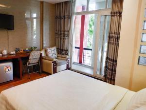 
Giường trong phòng chung tại Anh Dao Mekong Hotel
