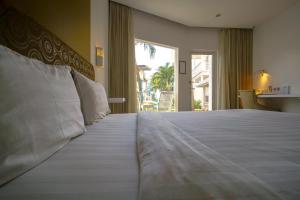 Katil atau katil-katil dalam bilik di Ocean View Residence