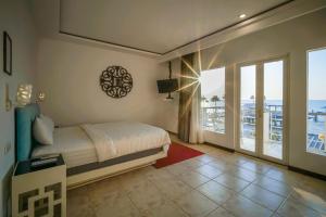 Katil atau katil-katil dalam bilik di Ocean View Residence