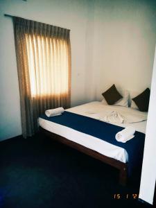 Postel nebo postele na pokoji v ubytování Hotel Star White - Negombo