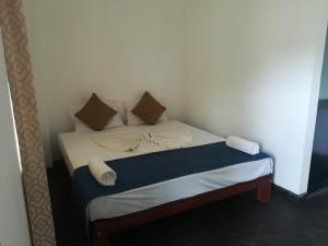 Postel nebo postele na pokoji v ubytování Hotel Star White - Negombo
