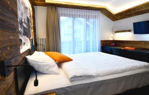Postel nebo postele na pokoji v ubytování Hotel Elite