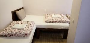 Un pat sau paturi într-o cameră la New hoover hostel