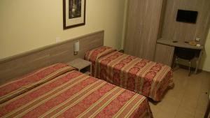 Letto o letti in una camera di Hotel Due Pini